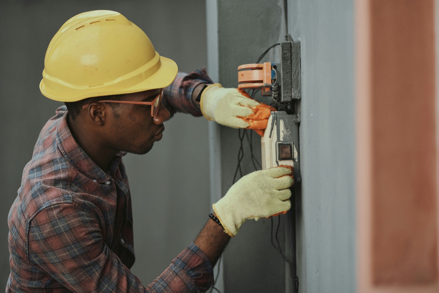 Field worker installing electrical equipment